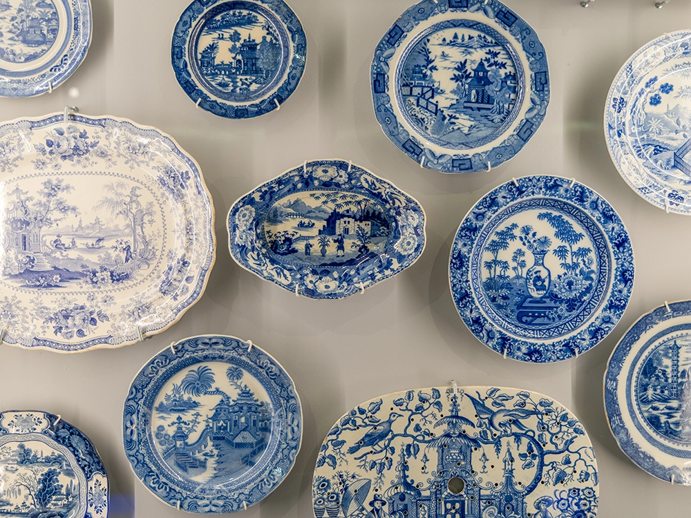 Blue china plates on exhibition wall